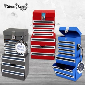 May include: Three decorative toolbox-shaped boxes in red, grey, and blue. Each box has a drawer and is decorated with silver and black stripes. The grey box has a "Happy Birthday" tag, and the blue box has a "Happy Father's Day" tag.