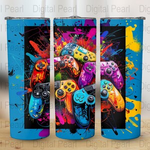 May include: A set of three colourful, blue, yellow and green, stainless steel tumblers with a graphic design of video game controllers on a blue background.
