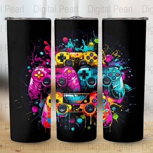 May include: A black tumbler with a colorful design of video game controllers with splashes of paint.