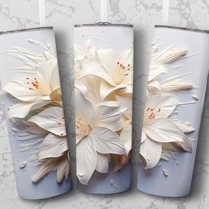 May include: Three white stainless steel tumblers with a white floral design. The flowers are 3D and look like they are made of paper.