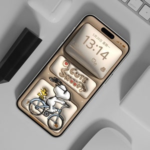 May include: A beige smartphone case featuring a cartoon image of Snoopy riding a bicycle with Woodstock on the back. The case has a gold trim and the text "Cute Snoopy" is written on the case. The phone screen displays a digital clock showing the time 13:14 and the date 5月20日 星期一.