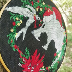 A picture of the finished embroidery of the Christmas Witcher from a different angle