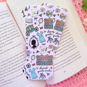 May include: A stack of three lavender bookmarks with a repeating pattern of illustrations including dresses, buildings, and butterflies. The text "dearest gentle reader" is also featured.