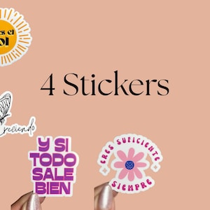 May include: Four stickers with inspirational phrases and designs. One sticker features a sun with the text "eres el sol." Another has a butterfly and the words "Estoy Creciendo." The other two stickers have the phrases "Y si todo sale bien" and "Eres suficiente siempre."