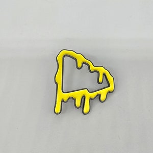 Yellow drip pin for New era hats
