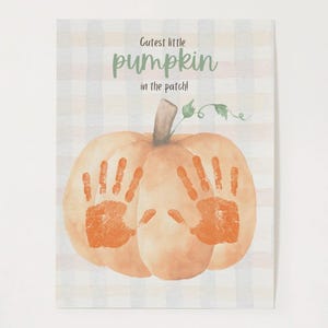 May include: Watercolor illustration of a pumpkin with orange handprints. The text "Cutest little pumpkin in the patch!" is written in green script. The background is a light plaid pattern.