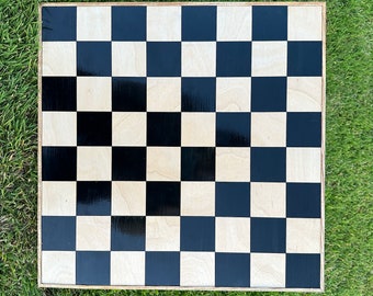 large vintage style wooden veneer inlaid chess set game board with 1&1/2 inch or 2 inch black and wooden squares.