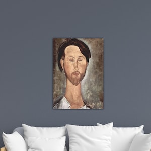 May include: A framed portrait of a man with a beard and dark hair. The artwork features a muted color palette with shades of brown, beige, and white. The man's face is the focal point, with a long neck and a contemplative expression.