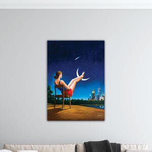 May include: A painting depicts a woman seated in a chair, gazing at a crescent moon in a starry night sky. She wears a blue top and red shorts. A city skyline is visible in the distance, with a dark blue and green landscape.