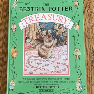 May include: A green book cover with the title "The Beatrix Potter Treasury" in white lettering. The cover features an illustration of a mouse sewing with a needle and thread. The book includes the stories "The Tailor of Gloucester", "The Tale of Tom Kitten", "The Tale of the Flopsy Bunnies", and "The Tale of Pigling Bland".