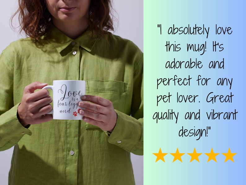 May include: White ceramic mug with black text that reads "Love is a four-legged word" with two red paw prints. The mug is being held by a person wearing a green shirt.