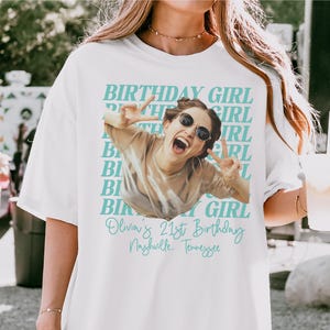 May include: White t-shirt with a photo of a woman wearing sunglasses and making a peace sign. The shirt has the words "BIRTHDAY GIRL" in a repeating pattern and "Olivia's 21st Birthday, Nashville, Tennessee" in script.