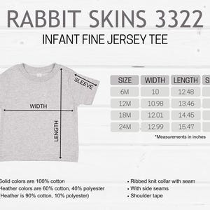 May include: A light gray infant fine jersey tee shirt with measurements in inches. The shirt has a ribbed knit collar, side seams, and shoulder tape. Solid colors are 100% cotton. Heather colors are 60% cotton, 40% polyester.