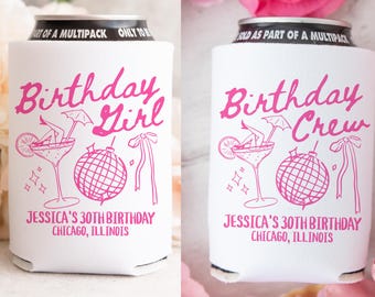 May include: Two white can coolers with pink text and illustrations. One cooler says "Birthday Girl" and the other says "Birthday Crew". Both coolers have a martini glass with a woman's legs sticking out, a disco ball, and a ribbon. The text below the illustrations says "Jessica's 30th Birthday Chicago, Illinois".