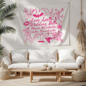 May include: A white tapestry with pink illustrations and text that reads "Love Spells & Wedding Bells Olivia's Bachelorette Salem, Massachusetts." The design includes a bat, moon, skeleton, witch hat, and other themed graphics.