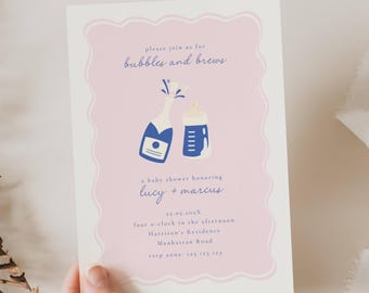 May include: A baby shower invitation with a pink background and a white border. The invitation features a champagne bottle and a baby bottle illustration. Text includes "bubbles and brews" and details for the event honoring Lucy and Marcus.