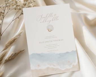 May include: A cream-colored invitation with the text "Seashells & Wedding Bells" and a seashell graphic. The invitation features a watercolor design of a beach scene with blue waves and sand. The invitation is for a bridal shower honoring Elizabeth Thomas.