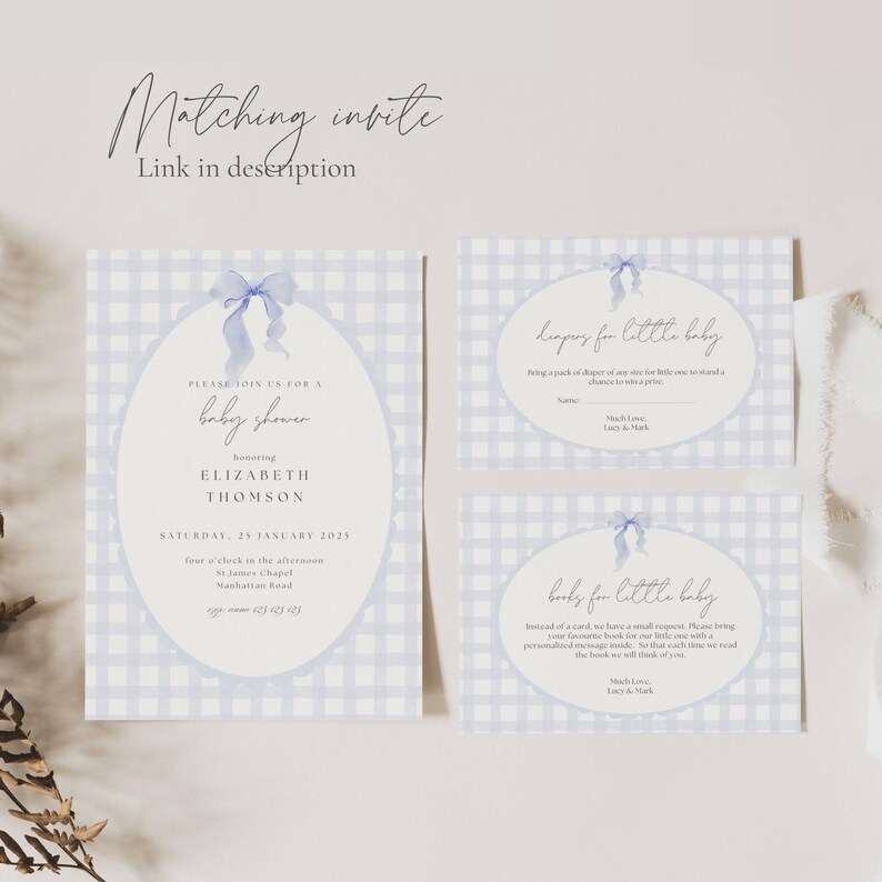 May include: Baby shower invitation set with a light blue gingham pattern. The main invitation features an oval frame with a blue bow and the text "baby shower" and details for Elizabeth Thomson. Includes inserts for diapers and books.