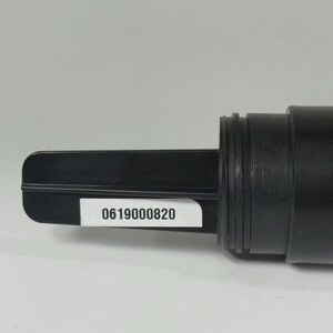 May include: A black plastic component with a rectangular paddle-like end and a cylindrical body. A white sticker with the number "0619000820" is affixed to the paddle. The object appears to be a part of a larger mechanism or device.