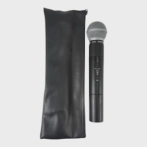 May include: A black Shure SM58 microphone with a silver mesh head, next to a black leather carrying case. The microphone has control buttons and a ribbed base. The case has the brand name printed on it.