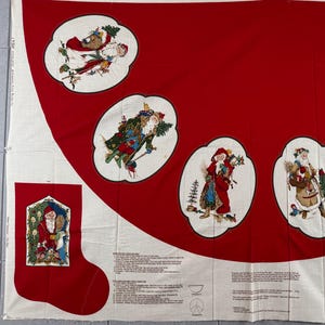 May include: A red and off-white fabric panel featuring printed illustrations of Santa Claus in various winter scenes within oval frames. The panel includes two stocking shapes and printed sewing instructions for creating holiday decorations.
