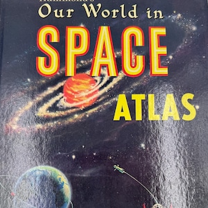 May include: A vintage hardcover book titled "Hammond's Our World in Space Atlas." The cover features a dark blue background with a colorful illustration of a planet, a galaxy, and the text "SPACE" in large, yellow letters. The book has 70 pages with 50 world and space maps in full color.