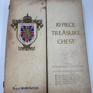 May include: A vintage 19-piece Sheffield English Stainless Steel treasure chest. The box is beige with text and a crest that reads "Sheffield English Blades." The chest includes kitchen, carving, snack, hostess, and steak knife sets.