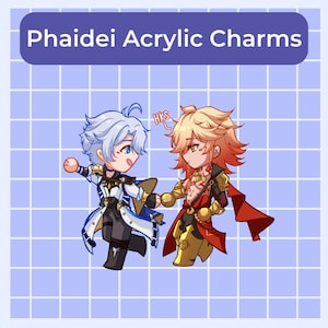 以下が含まれることがあります： 2人のアニメ風キャラクターが描かれたアクリルチャーム。一人は水色の髪で、白と黒の衣装に青のアクセント。もう一人は金色の髪で、赤と金の衣装。上部には「Phaidei Acrylic Charms」の文字。