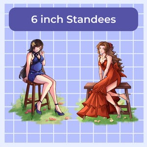 May include: Two 6-inch standees of anime characters. One character is in a blue dress, the other in a red dress. Both are seated on wooden stools. The background is a light blue grid pattern with green grass and flowers.