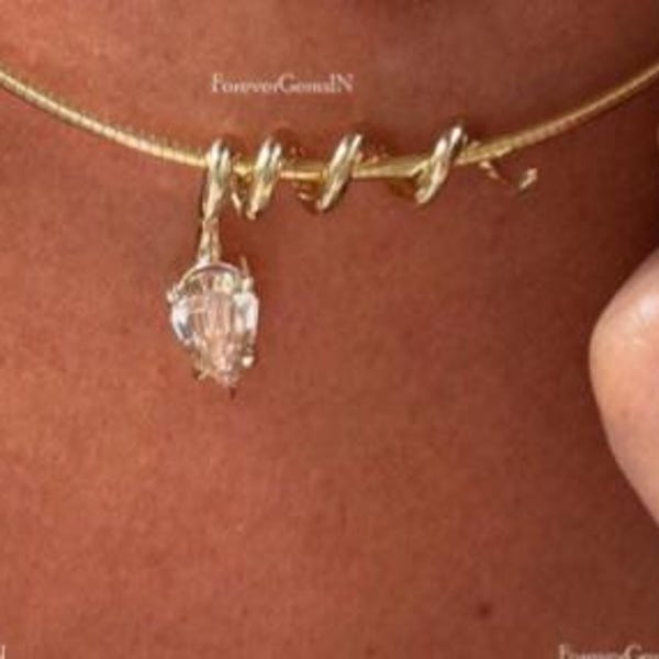 2.00 CT pear cut and with 1.25 mm diameter 14k yellow gold wrapping pendant