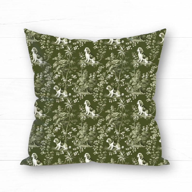 May include: A green throw pillow with a repeating pattern of white dogs and foliage. The dogs are in a seated position and the foliage is stylized.