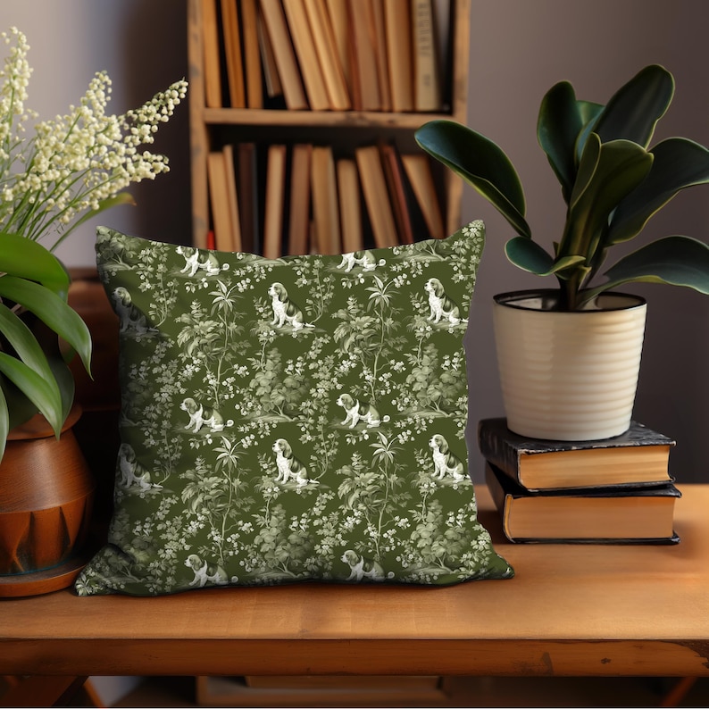 May include: A green throw pillow with a white floral pattern and a repeating image of a dog. The pillow is sitting on a wooden table.