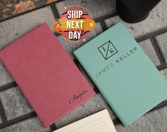 May include: Two personalized leather journals, one pink with the name "Angela" and one teal with the initials "J.K." and the name "JAMES KELLER".