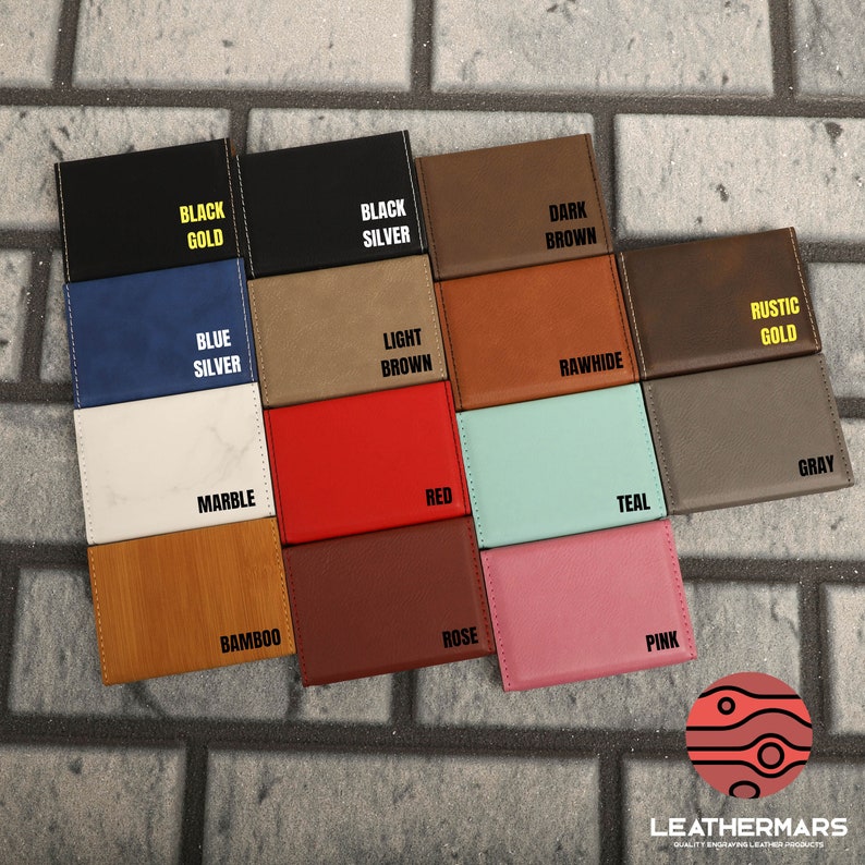May include: A variety of 12 different colored leather card holders with different text labels. The labels include: Black Gold, Black Silver, Dark Brown, Blue Silver, Light Brown, Rawhide, Marble, Red, Teal, Bamboo, Rose, Rustic Gold, Gray, and Pink.