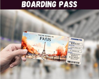 Könnte beinhalten: Eine rechteckige Bordkarte mit einer Aquarellillustration des Eiffelturms in Paris, umgeben von orangefarbenen Herbstbäumen. Der Text lautet You're Going To Paris, Boarding Pass, Hayley, 20 December 23, 15 January 24 und Surprise!! Happy Birthday Hayley!