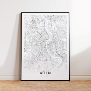 Puede incluir: Impresión en blanco y negro de un mapa de Colonia, Alemania. El mapa muestra las calles de la ciudad y el río Rin. El texto "KÖLN GERMANY" está impreso en la parte inferior del mapa.