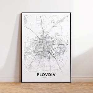 May include: A black and white map print of Plovdiv, Bulgaria. The map shows the city's streets and landmarks.