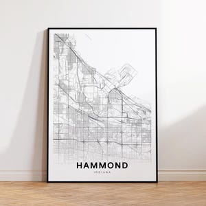 May include: Black and white line art map print of Hammond, Indiana. The map shows the city streets and features the city name and state.