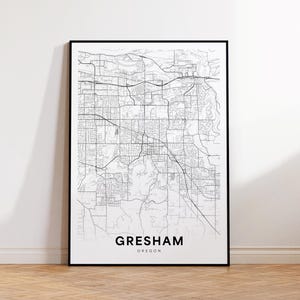 May include: Black and white line art map print of Gresham, Oregon. The map shows the city's street layout and includes the city name and state.