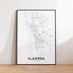 May include: Black and white line art map print of Klaipėda, Lithuania. The map shows the city's streets and waterways. The city name and country are printed below the map.