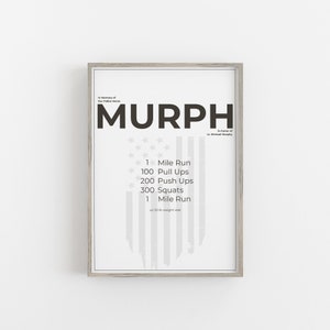 May include: A framed print with the word "MURPH" in large, bold letters. The print includes a workout routine with exercises like pull-ups and squats, and the text "In honor of Lt. Michael Murphy."