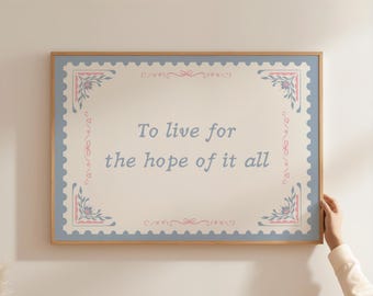 May include: A rectangular wall art print in a light wooden frame featuring a cream-colored background with a blue postage stamp-style border. The text "To live for the hope of it all" is centered in blue, accented by pink and blue floral corner motifs.