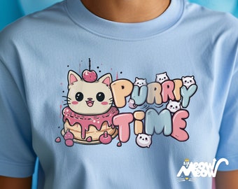 May include: A light blue t-shirt with a cartoon cat wearing a pink and white cake hat. The text "Purrry Time" is written in a colorful font with smaller cartoon cats around the text. The bottom of the shirt has the text "Sir Meow Meow" in a black and white font.