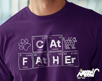 May include: Purple t-shirt with a white graphic of the word "CAT" spelled out using chemical element symbols. The graphic also includes a paw print and a stylized image of a cat.