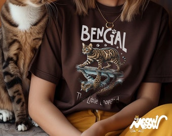 May include: A brown t-shirt with a Bengal cat graphic and the text "Bengal The Little Leopard".