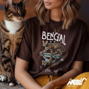 May include: A brown t-shirt with a Bengal cat graphic and the text "Bengal The Little Leopard".