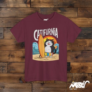 Catifurnia Unisex Shirt: Fun Surfing Cat Design, Beach Lover Gift Maroon