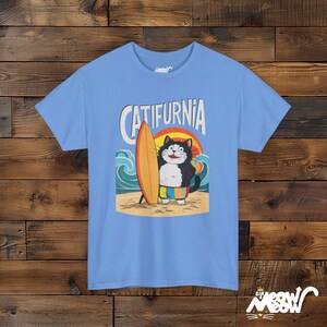 Catifurnia Unisex Shirt: Fun Surfing Cat Design, Beach Lover Gift Carolina Blue