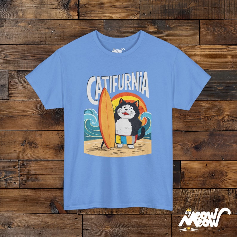 Catifurnia Unisex Shirt: Fun Surfing Cat Design, Beach Lover Gift Carolina Blue