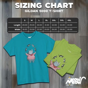 May include: A sizing chart for Gildan 5000 T-shirts, showing measurements in inches for length and width, for sizes S through 4XL. The chart is on a woodgrain background.  A turquoise blue t-shirt with a cartoon rhinoceros juggling cats is shown on the left. A green t-shirt with the same rhinoceros design is shown on the right.